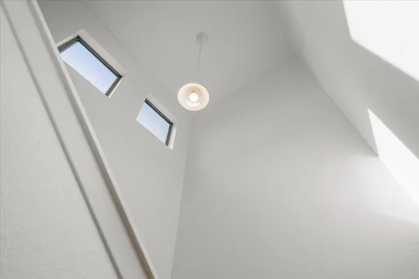 a view of empty room with ceiling fan