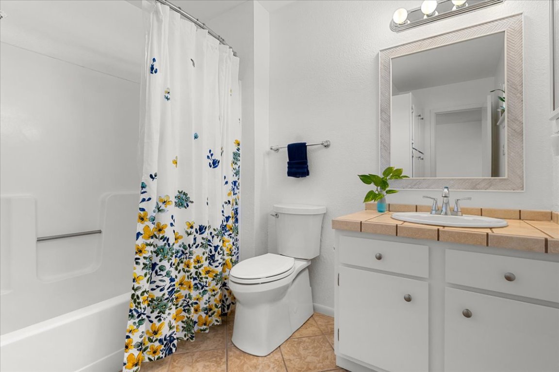 2104 Cullen Avenue, Unit 7204 Austin, TX 78757 - Photo 23 of 40 Primary full bathroom featuring vanity, shower / bath combination