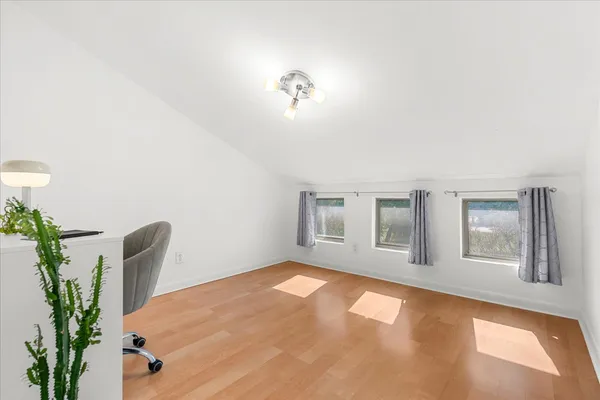 a view of a livingroom with furniture and windows