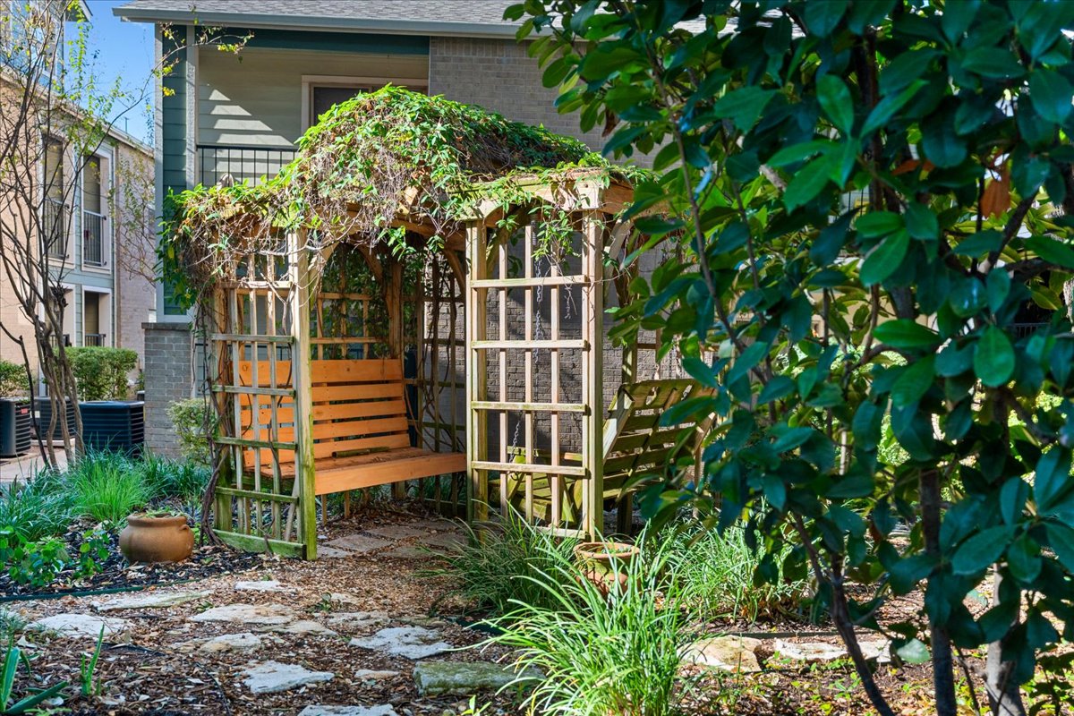 2104 Cullen Avenue, Unit 7204 Austin, TX 78757 - Photo 27 of 40 a view of a house with a flower garden