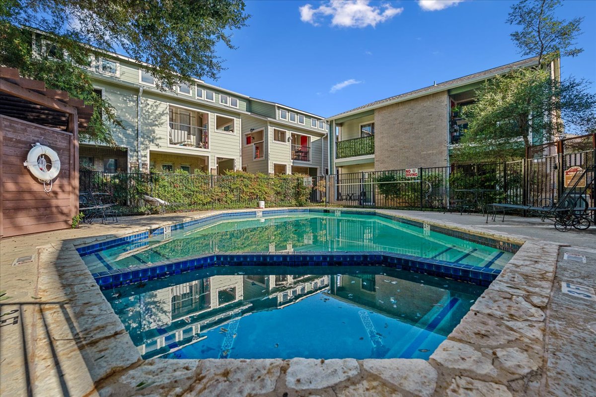 2104 Cullen Avenue, Unit 7204 Austin, TX 78757 - Photo 28 of 40 a front view of a house with swimming pool