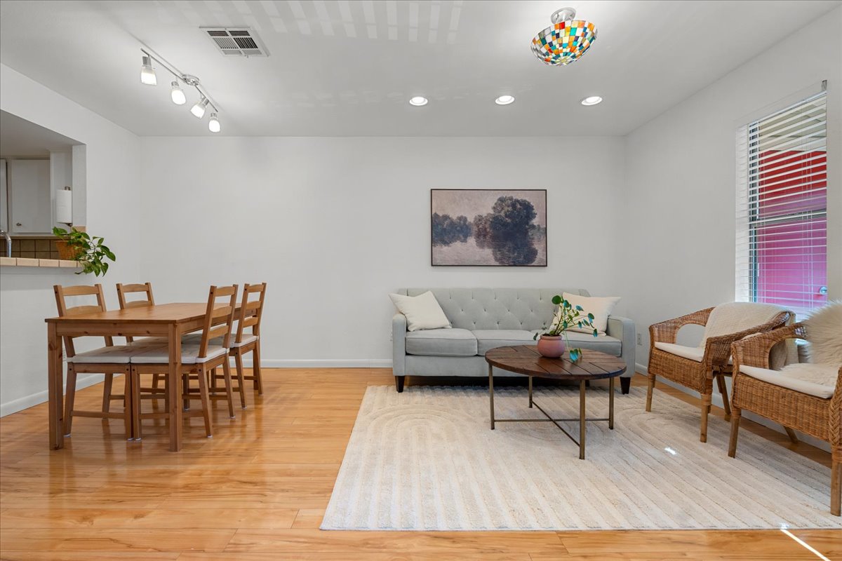 2104 Cullen Avenue, Unit 7204 Austin, TX 78757 - Photo 6 of 40 a living room with furniture and a wooden floor