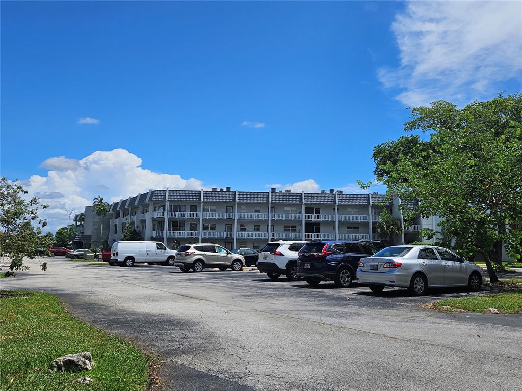 6650 Royal Palm Boulevard, Unit 315C Margate, FL 33063 - Photo 1 of 17 a car parked in front of a building