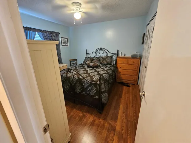 a bedroom with a bed and a mirror
