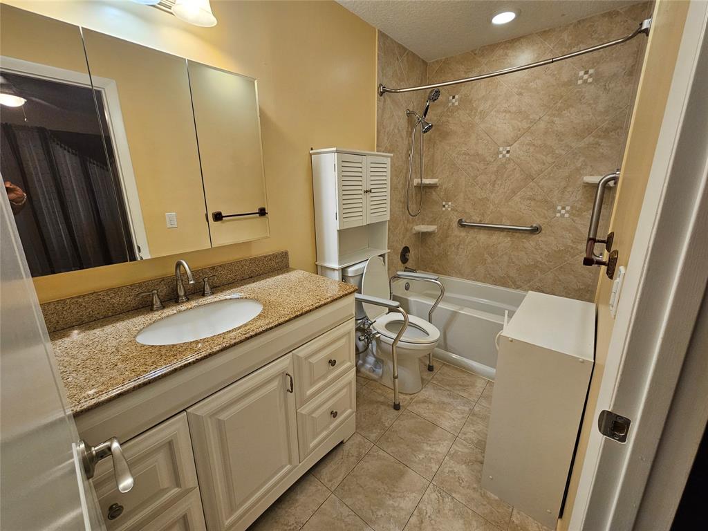 6650 Royal Palm Boulevard, Unit 315C Margate, FL 33063 - Photo 13 of 17 a bathroom with a granite countertop sink toilet and shower