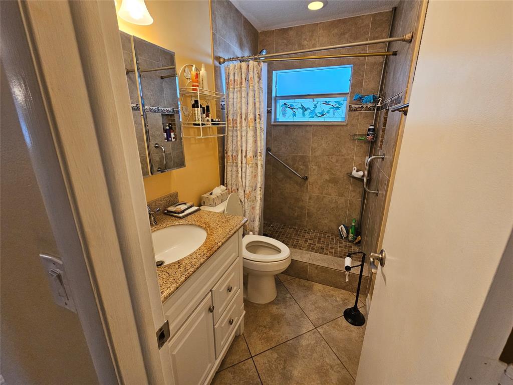 6650 Royal Palm Boulevard, Unit 315C Margate, FL 33063 - Photo 14 of 17 a bathroom with a granite countertop sink toilet and shower
