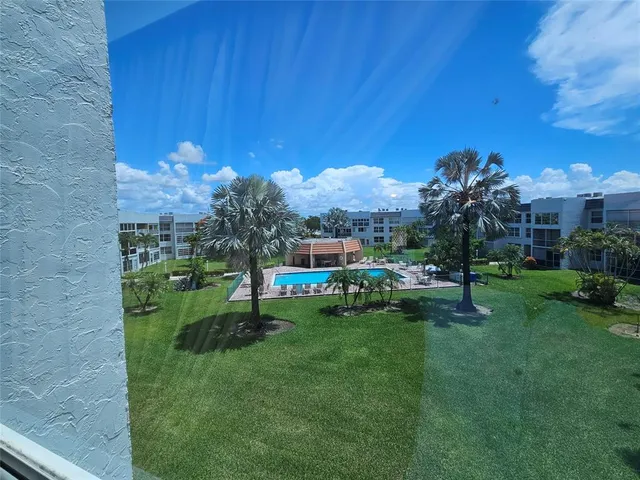 a view of a chair and table in the garden