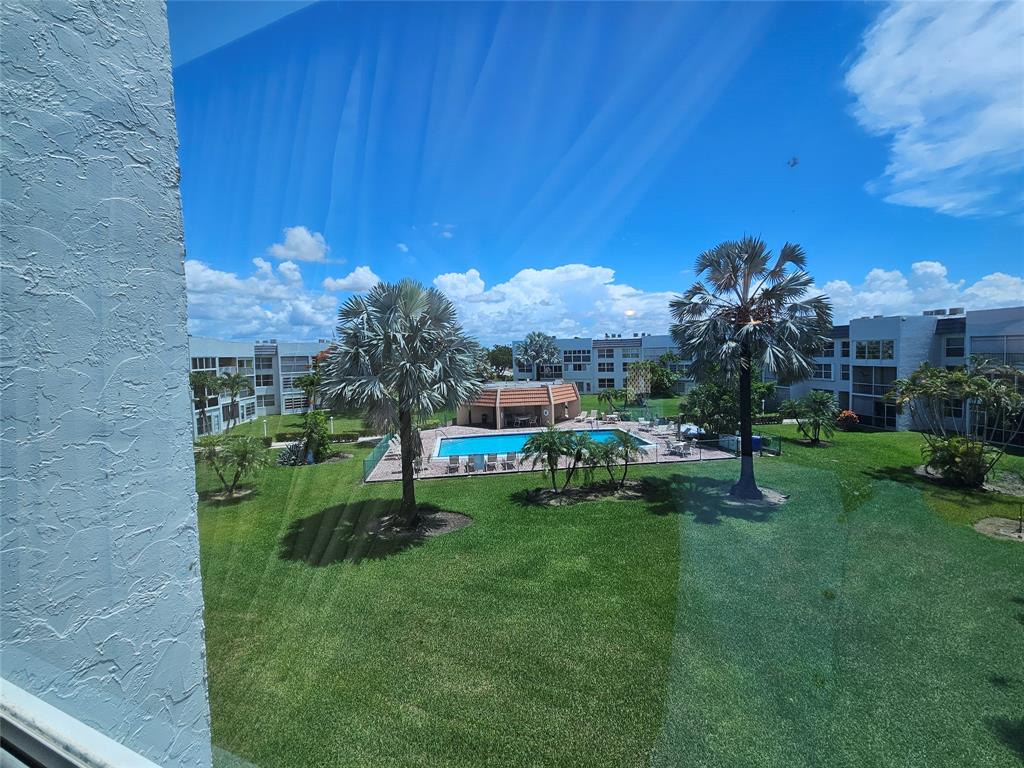 6650 Royal Palm Boulevard, Unit 315C Margate, FL 33063 - Photo 17 of 17 a view of a chair and table in the garden
