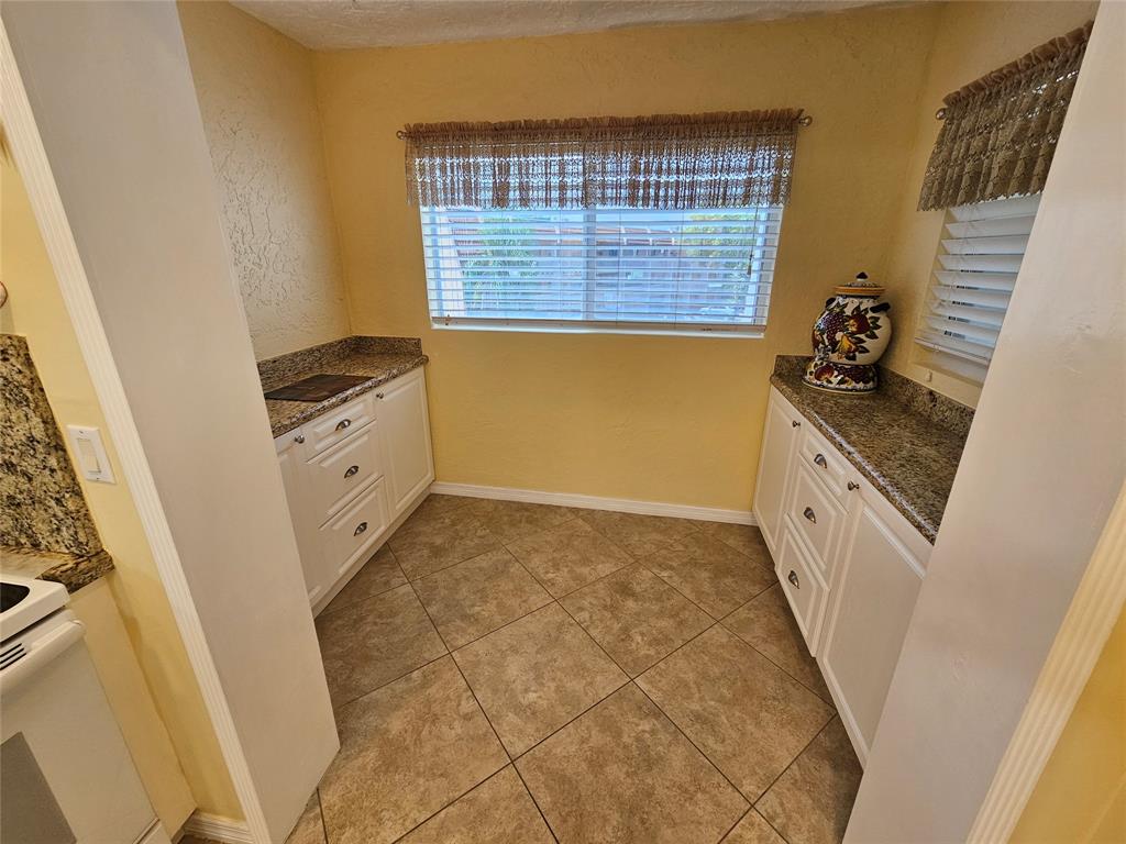 6650 Royal Palm Boulevard, Unit 315C Margate, FL 33063 - Photo 5 of 17 a bathroom with a sink a vanity and a mirror