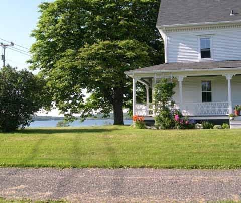 57 Old Ferry Road Deer Isle, ME 04627 - Photo 1 of 34 Porch and Water View of Eggemoggin Reach