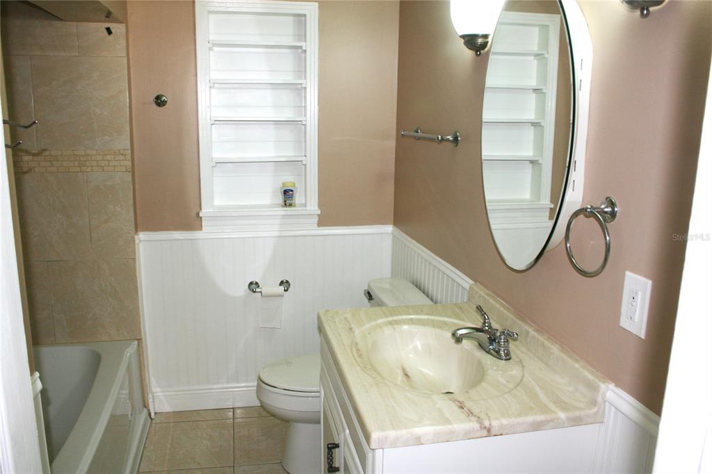 8006 North Rome Avenue Tampa, FL 33604 - Photo 12 of 44 a bathroom with a sink toilet and shower