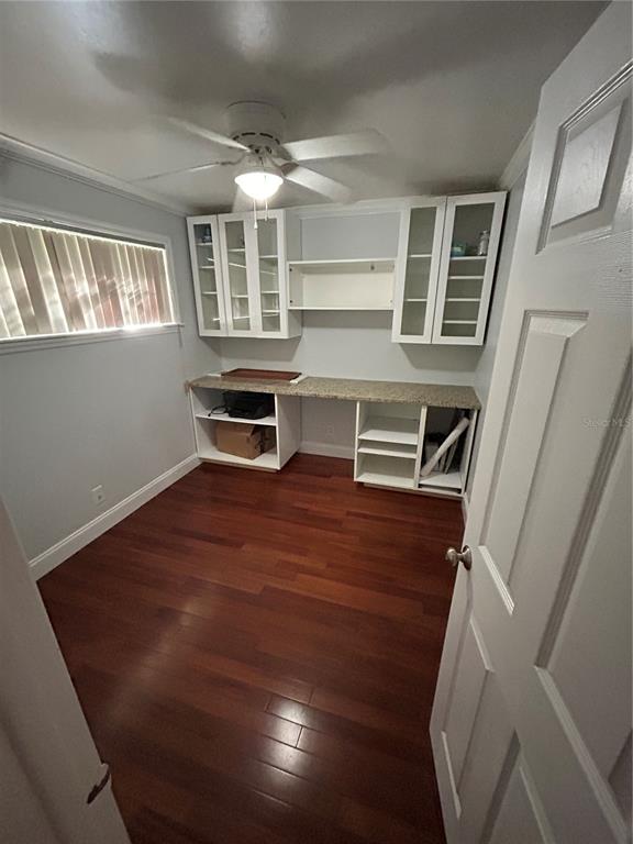 8006 North Rome Avenue Tampa, FL 33604 - Photo 15 of 43 a view of kitchen and empty room with wooden floor