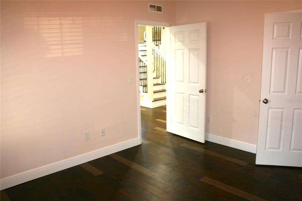 8006 North Rome Avenue Tampa, FL 33604 - Photo 21 of 43 an empty room with wooden floor and windows
