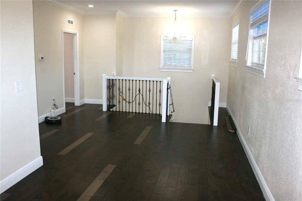 8006 North Rome Avenue Tampa, FL 33604 - Photo 28 of 43 an empty room with wooden floor and windows