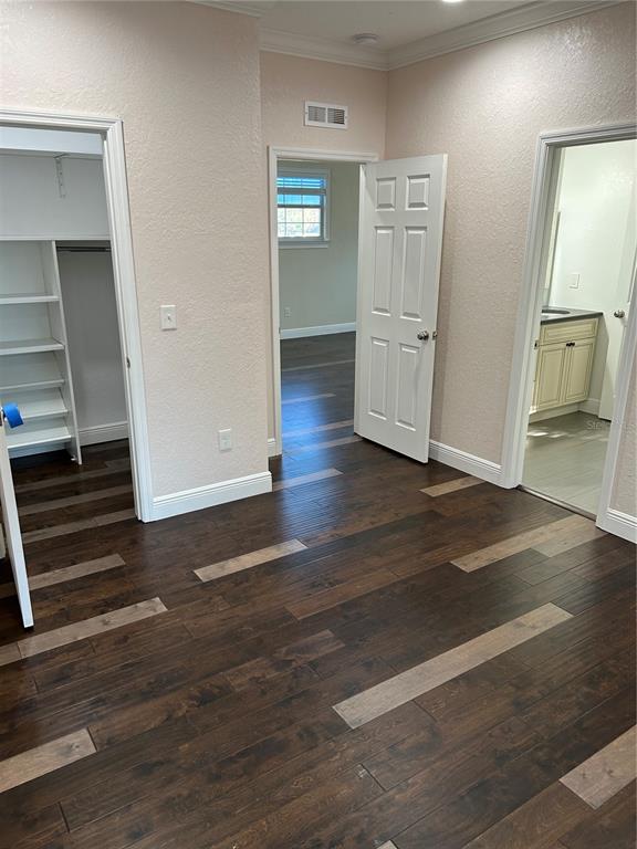 8006 North Rome Avenue Tampa, FL 33604 - Photo 37 of 43 an empty room with wooden floor cabinet and mirrors