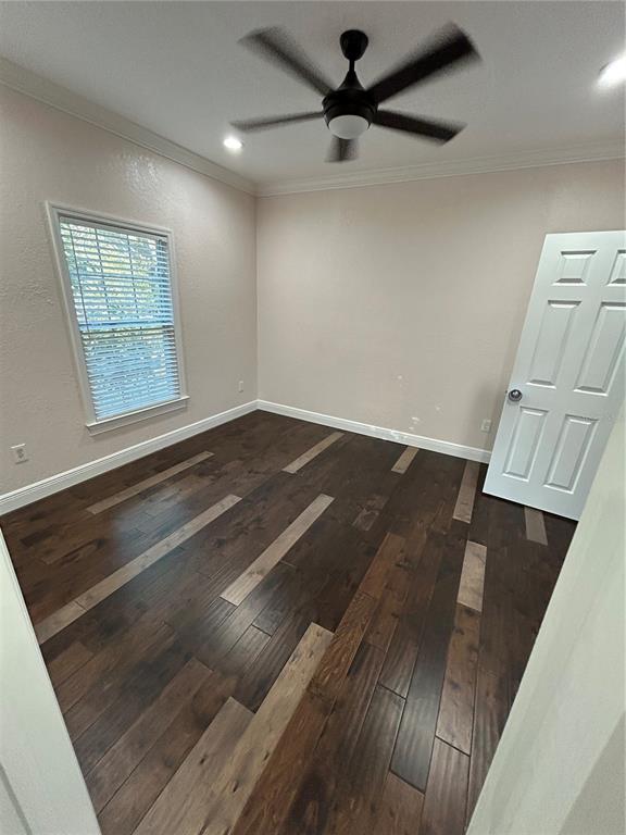 8006 North Rome Avenue Tampa, FL 33604 - Photo 39 of 43 an empty room with wooden floor fan and windows