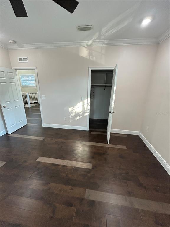 8006 North Rome Avenue Tampa, FL 33604 - Photo 41 of 43 an empty room with wooden floor and windows