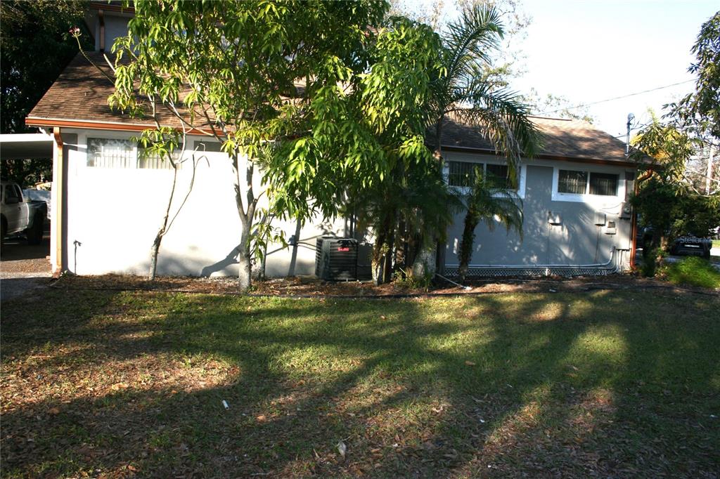 8006 North Rome Avenue Tampa, FL 33604 - Photo 43 of 43 a front view of a house with a yard