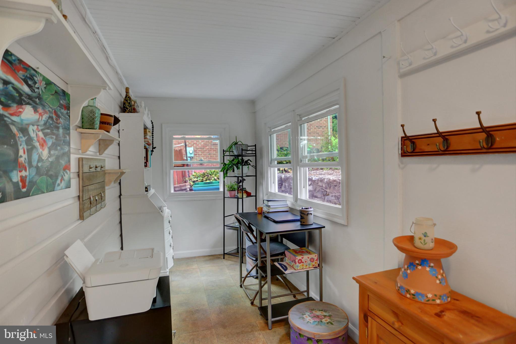 227 South Main Street Boonsboro, MD 21713 - Photo 15 of 53 a living room with furniture a window and a flat screen tv