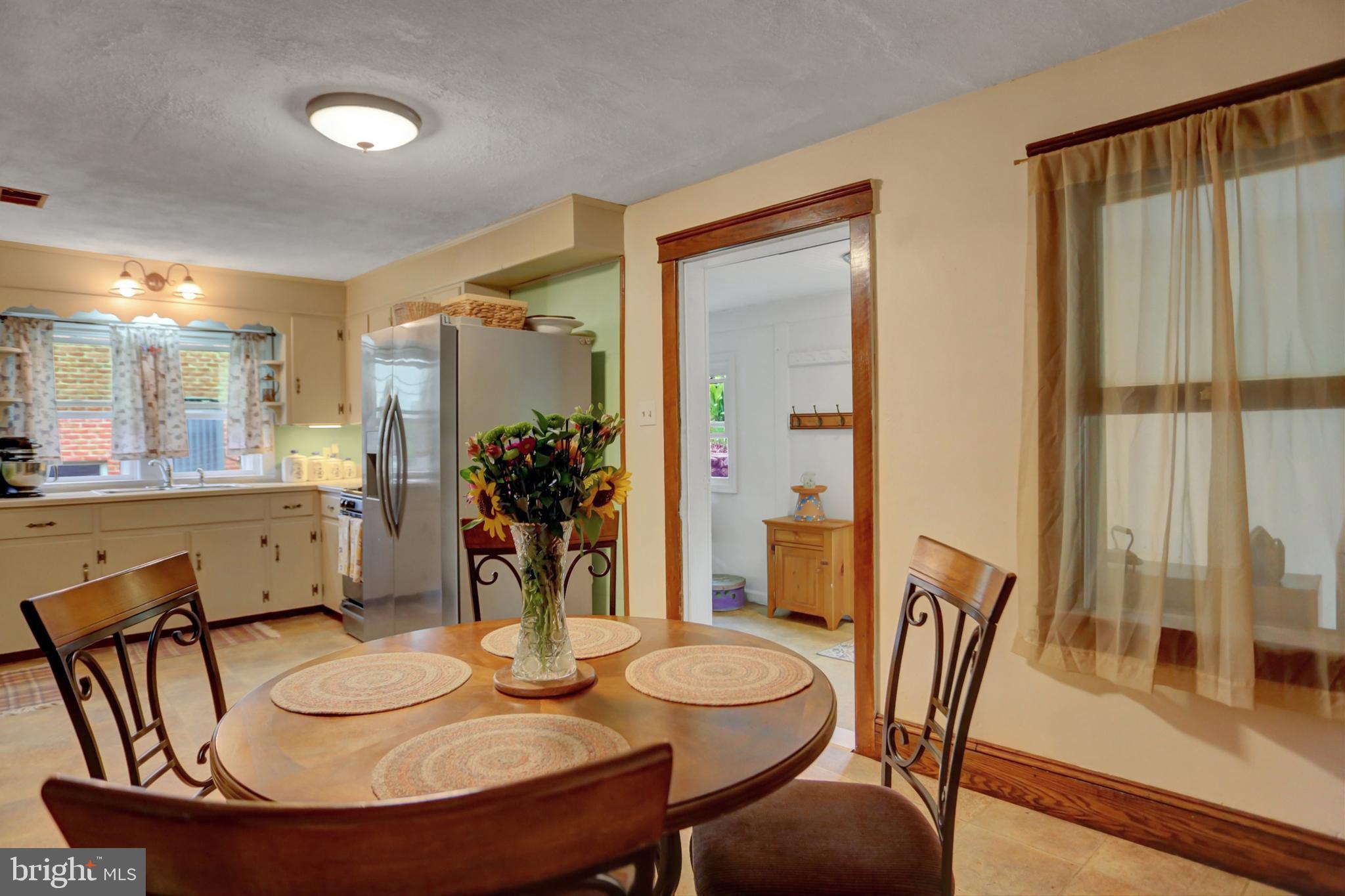 227 South Main Street Boonsboro, MD 21713 - Photo 17 of 53 a dining room with furniture and wooden floor