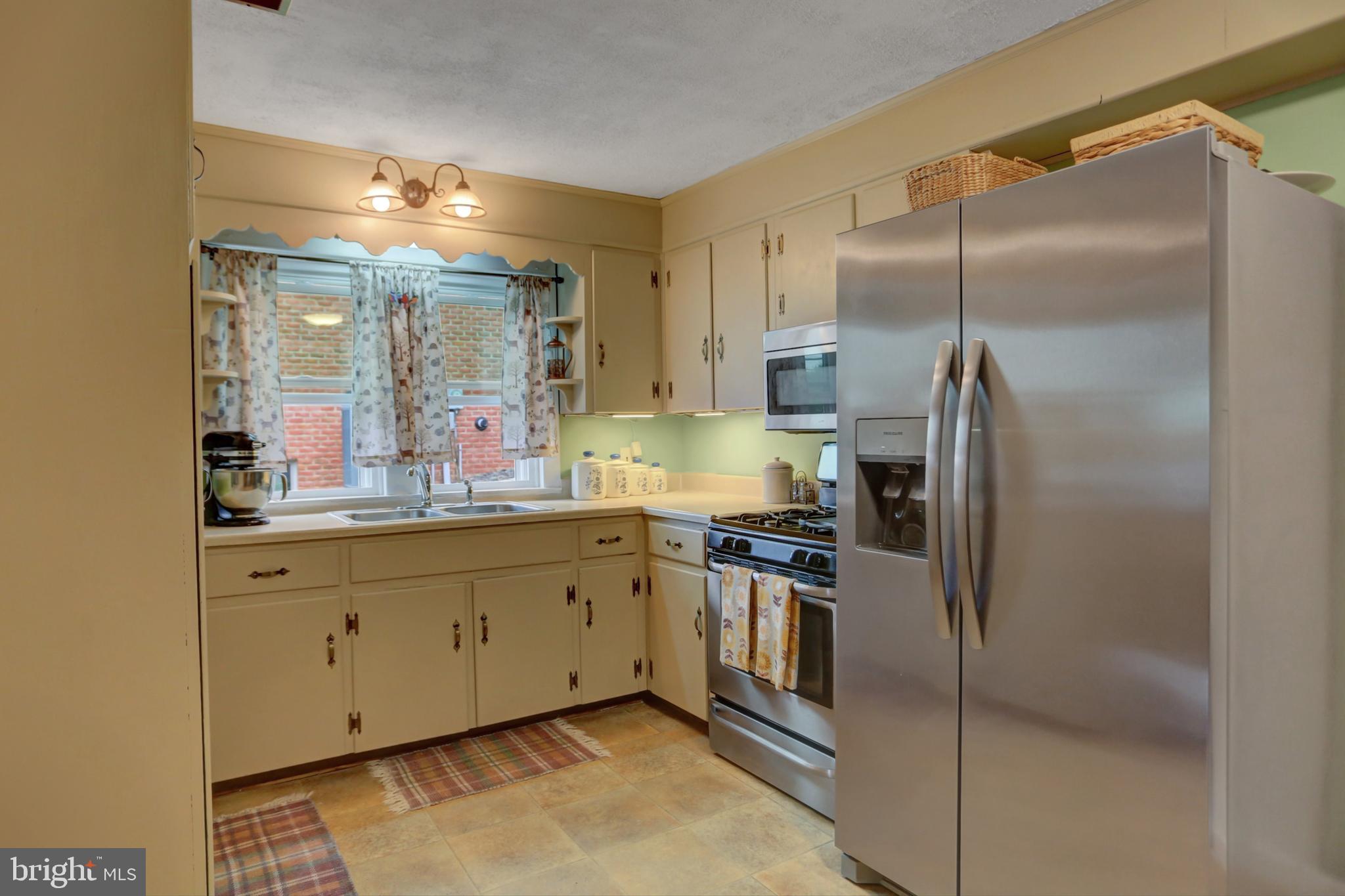 227 South Main Street Boonsboro, MD 21713 - Photo 18 of 53 a kitchen with stainless steel appliances granite countertop a refrigerator and a sink
