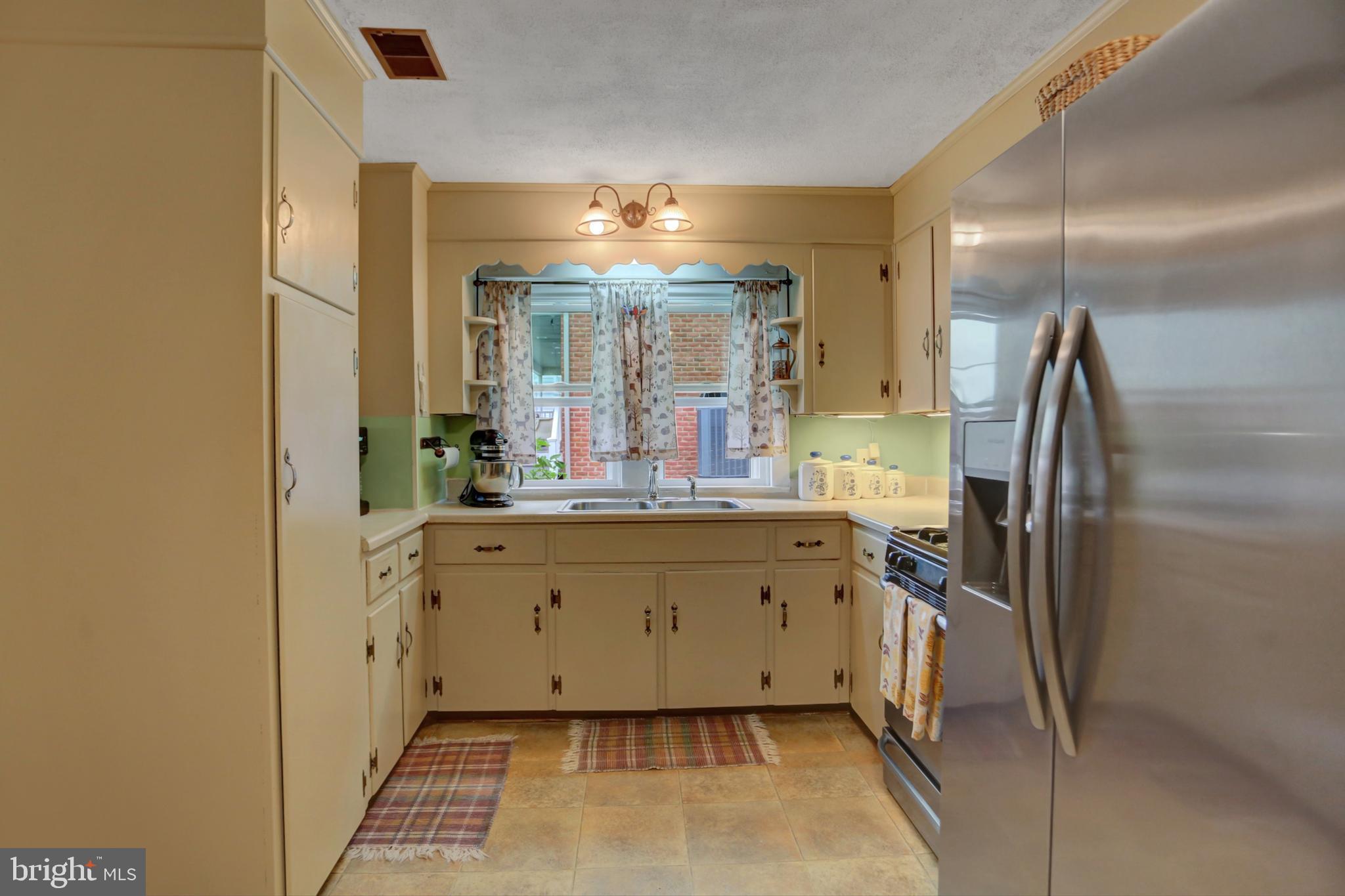 227 South Main Street Boonsboro, MD 21713 - Photo 19 of 53 a bathroom with double vanity and a mirror