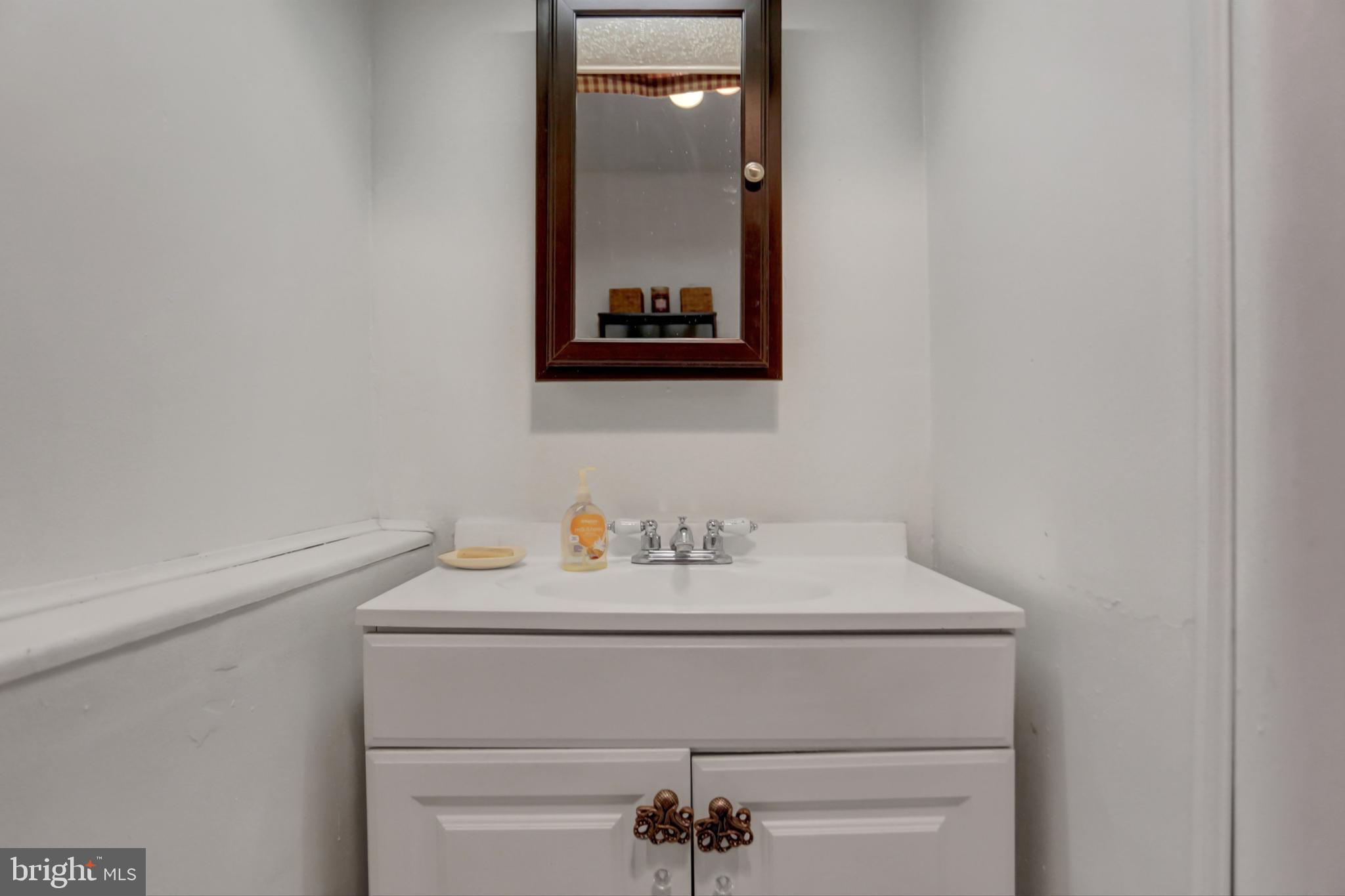 227 South Main Street Boonsboro, MD 21713 - Photo 24 of 53 a bathroom with a sink and a mirror