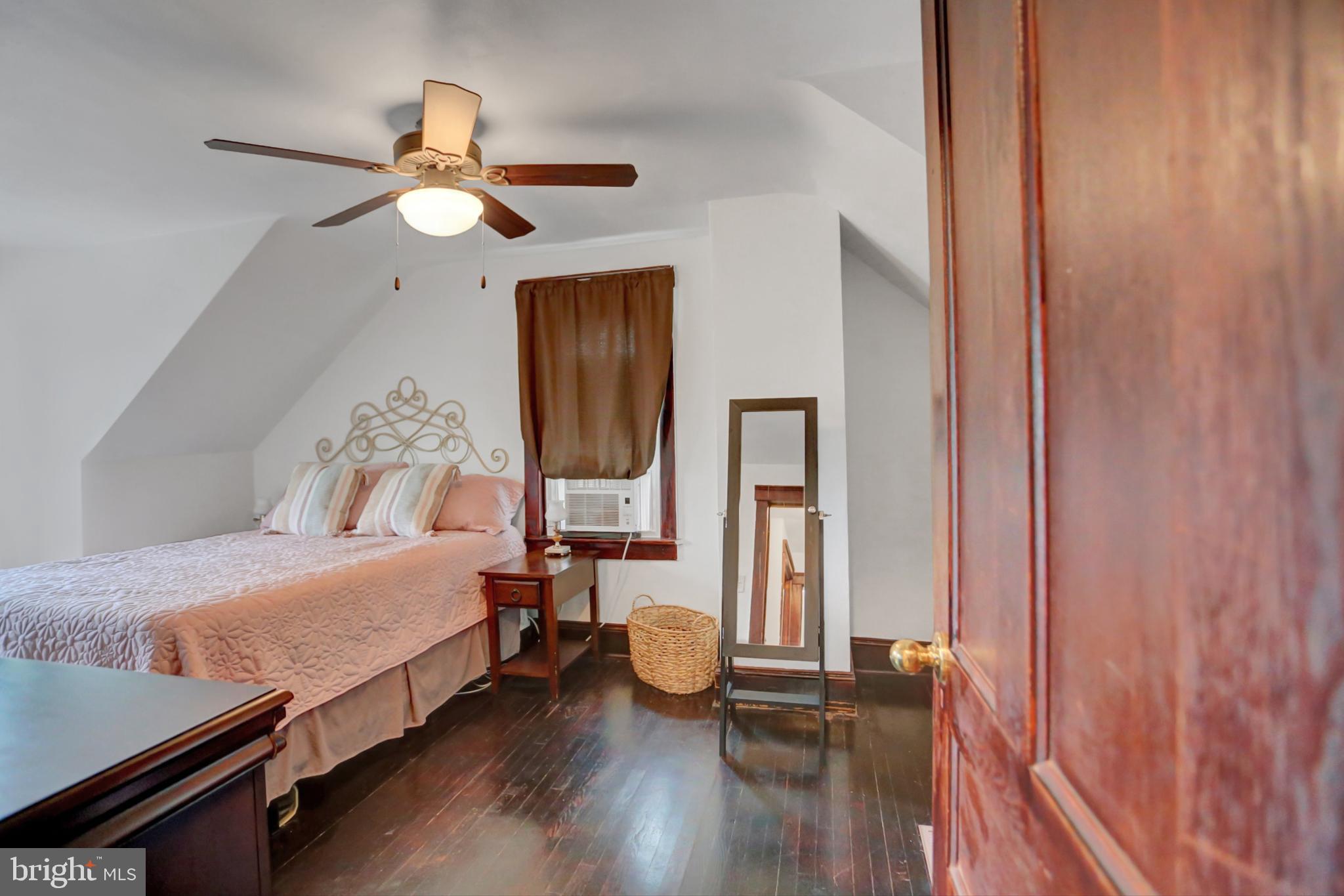 227 South Main Street Boonsboro, MD 21713 - Photo 25 of 53 a bedroom with a bed and wooden floor