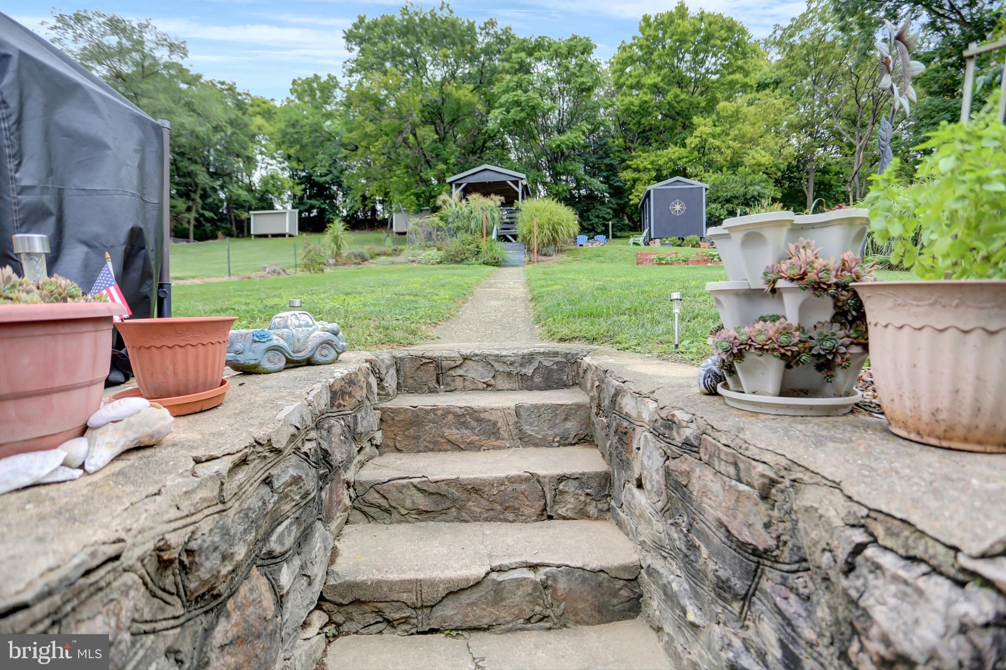 227 South Main Street Boonsboro, MD 21713 - Photo 39 of 53 a view of a backyard with sitting area and garden