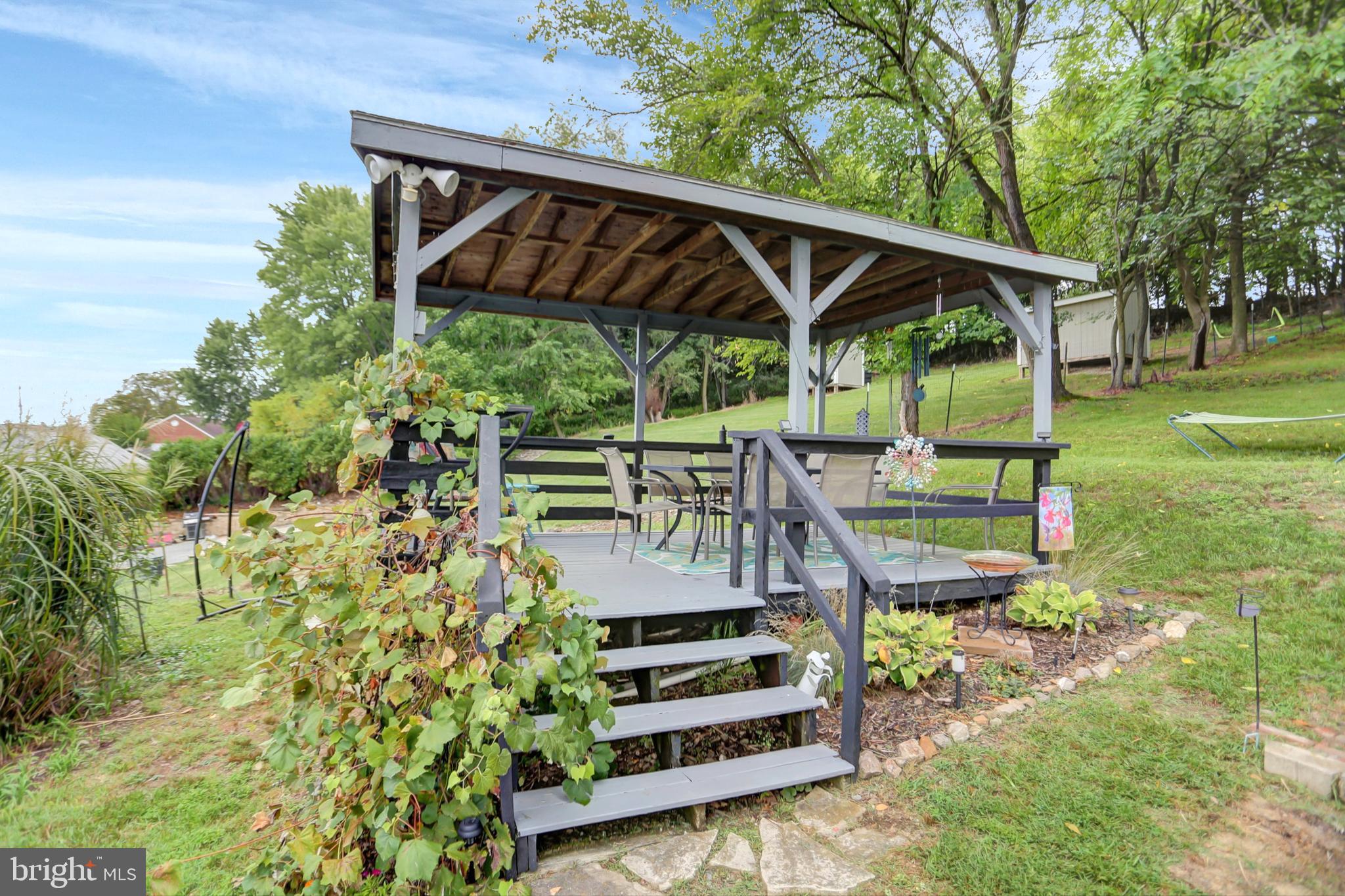 227 South Main Street Boonsboro, MD 21713 - Photo 42 of 53 a view of a backyard with wooden deck and a garden