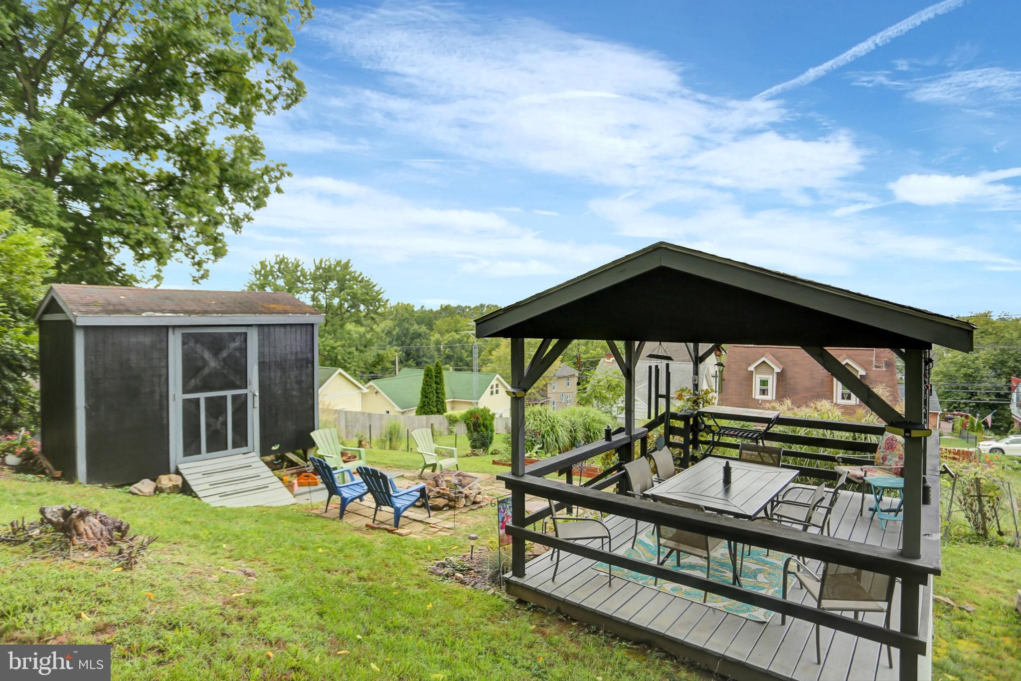 227 South Main Street Boonsboro, MD 21713 - Photo 45 of 53 a view of a deck with a table and chairs under an umbrella