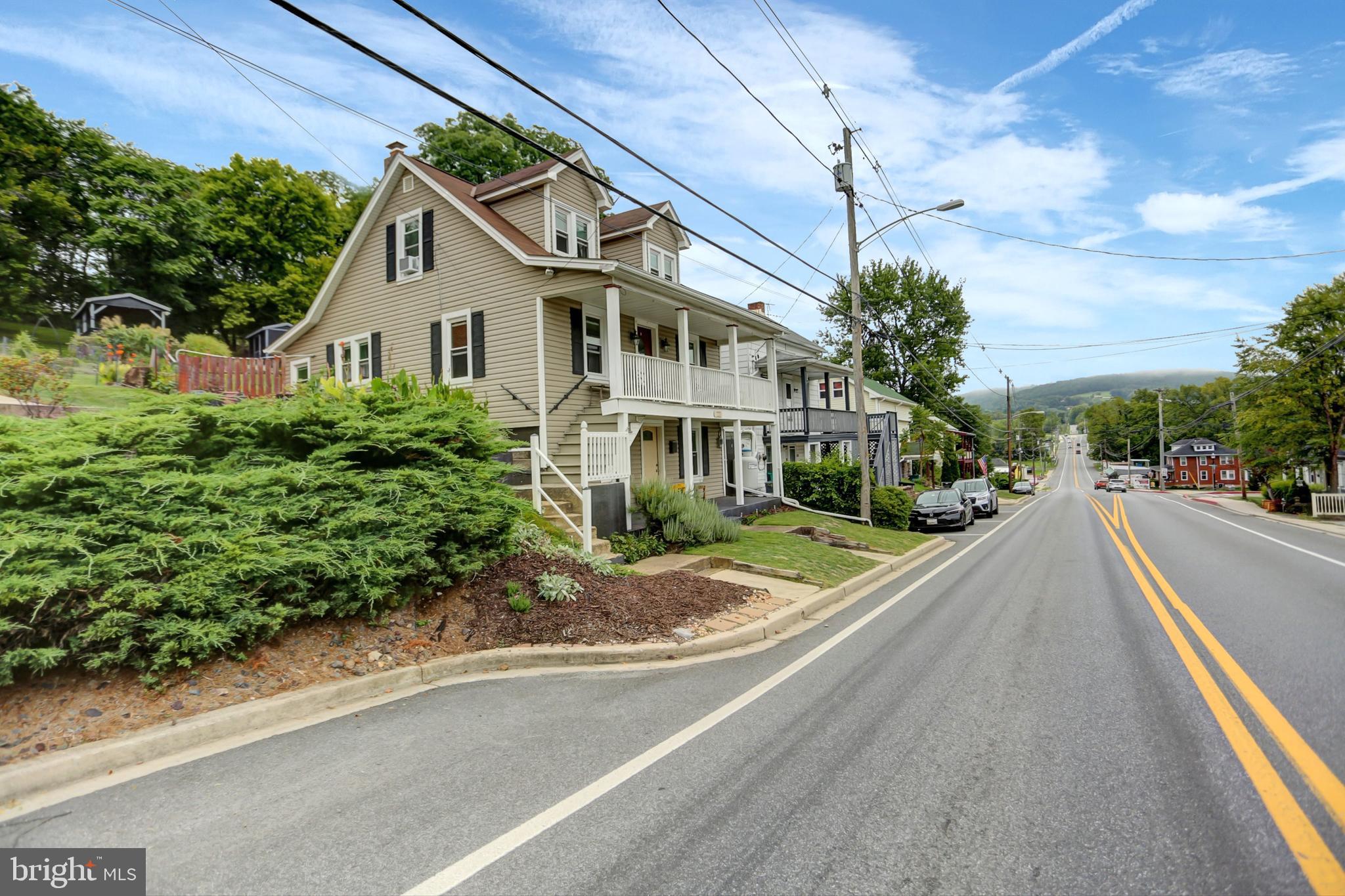 227 South Main Street Boonsboro, MD 21713 - Photo 53 of 53 a front view of a house with a yard and potted plants