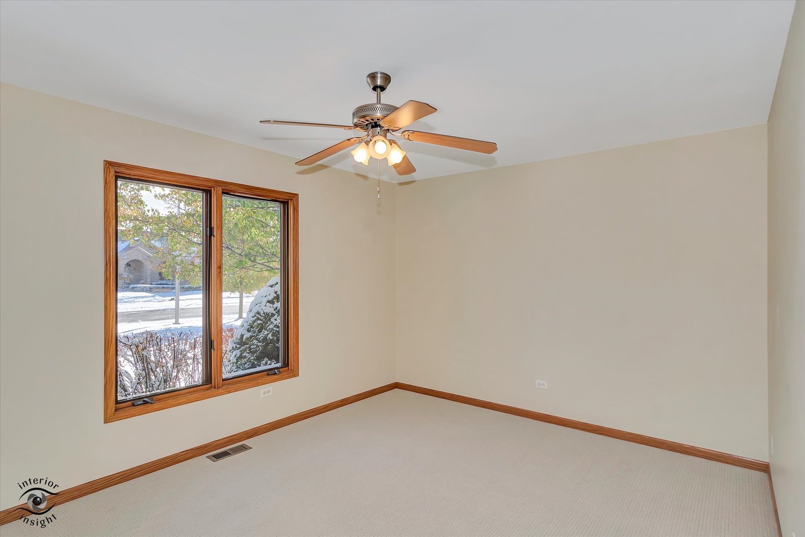 19612 Waterford Lane Mokena, IL 60448 - Photo 18 of 28 a view of an empty room with chandelier fan and a window