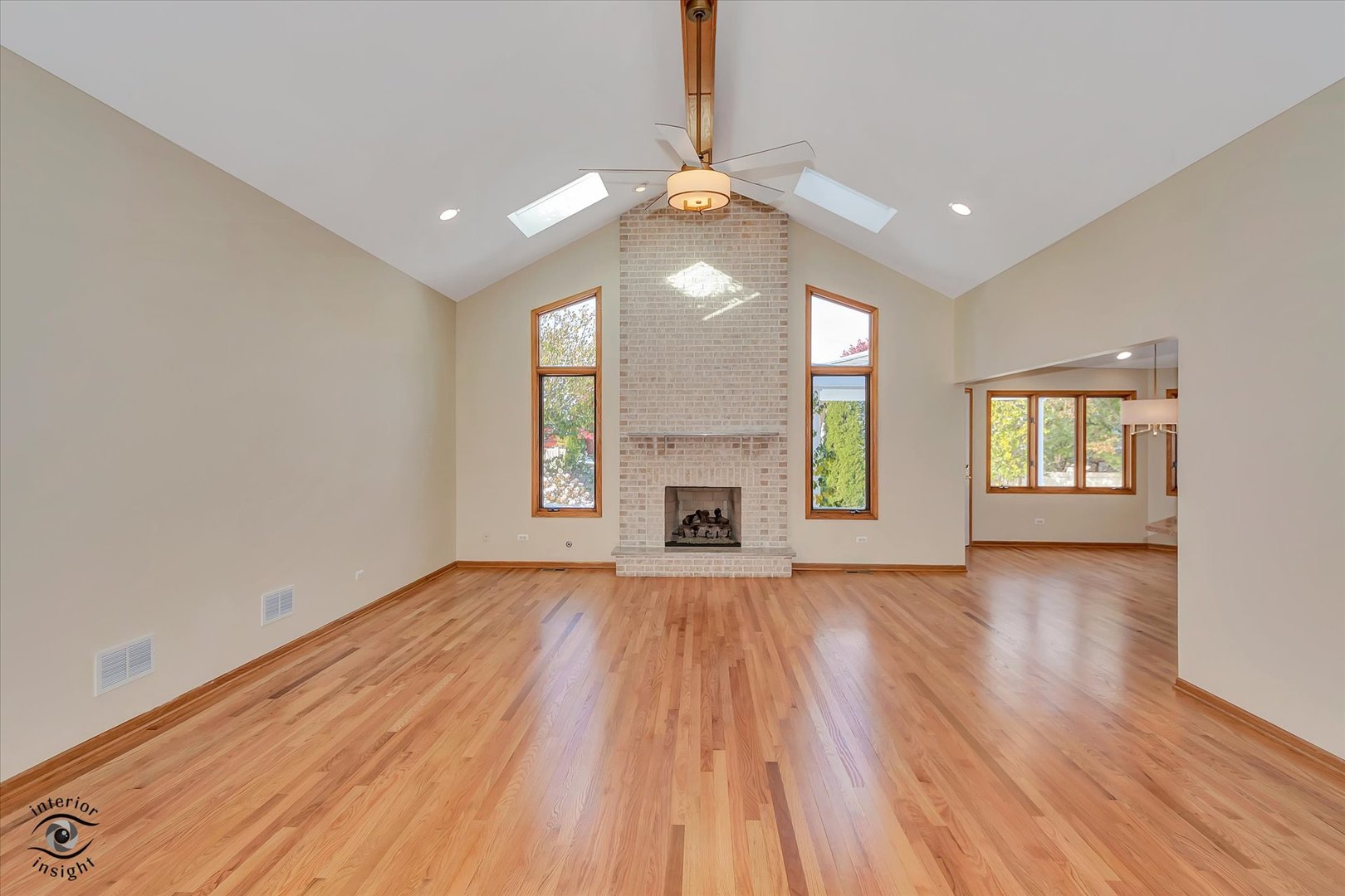 19612 Waterford Lane Mokena, IL 60448 - Photo 4 of 28 an empty room with wooden floor and windows