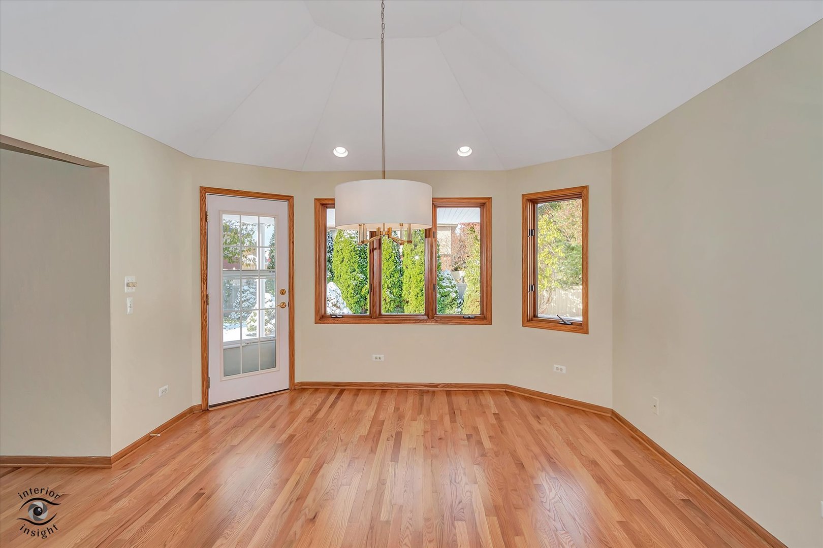 19612 Waterford Lane Mokena, IL 60448 - Photo 8 of 28 an empty room with wooden floor and windows