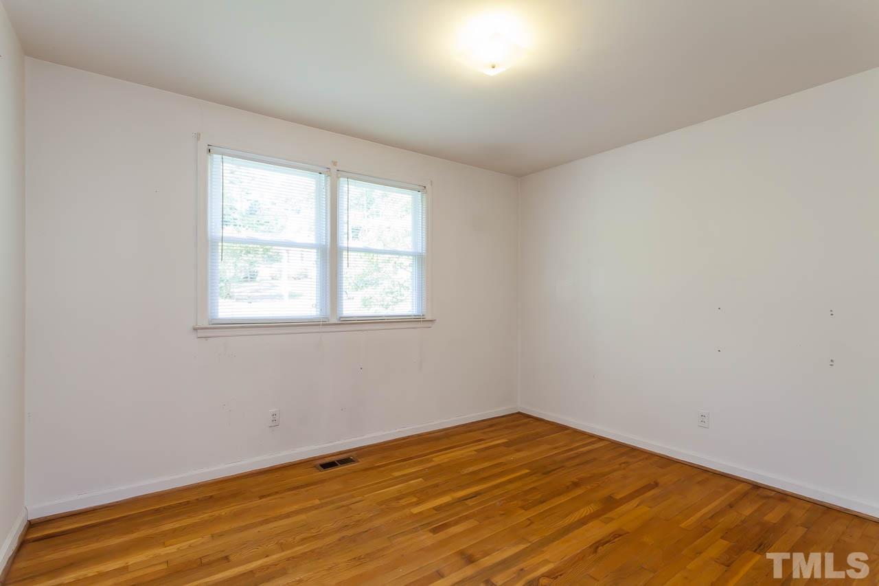 2252 Rumson Road Raleigh, NC 27610 - Photo 14 of 20 an empty room with a window