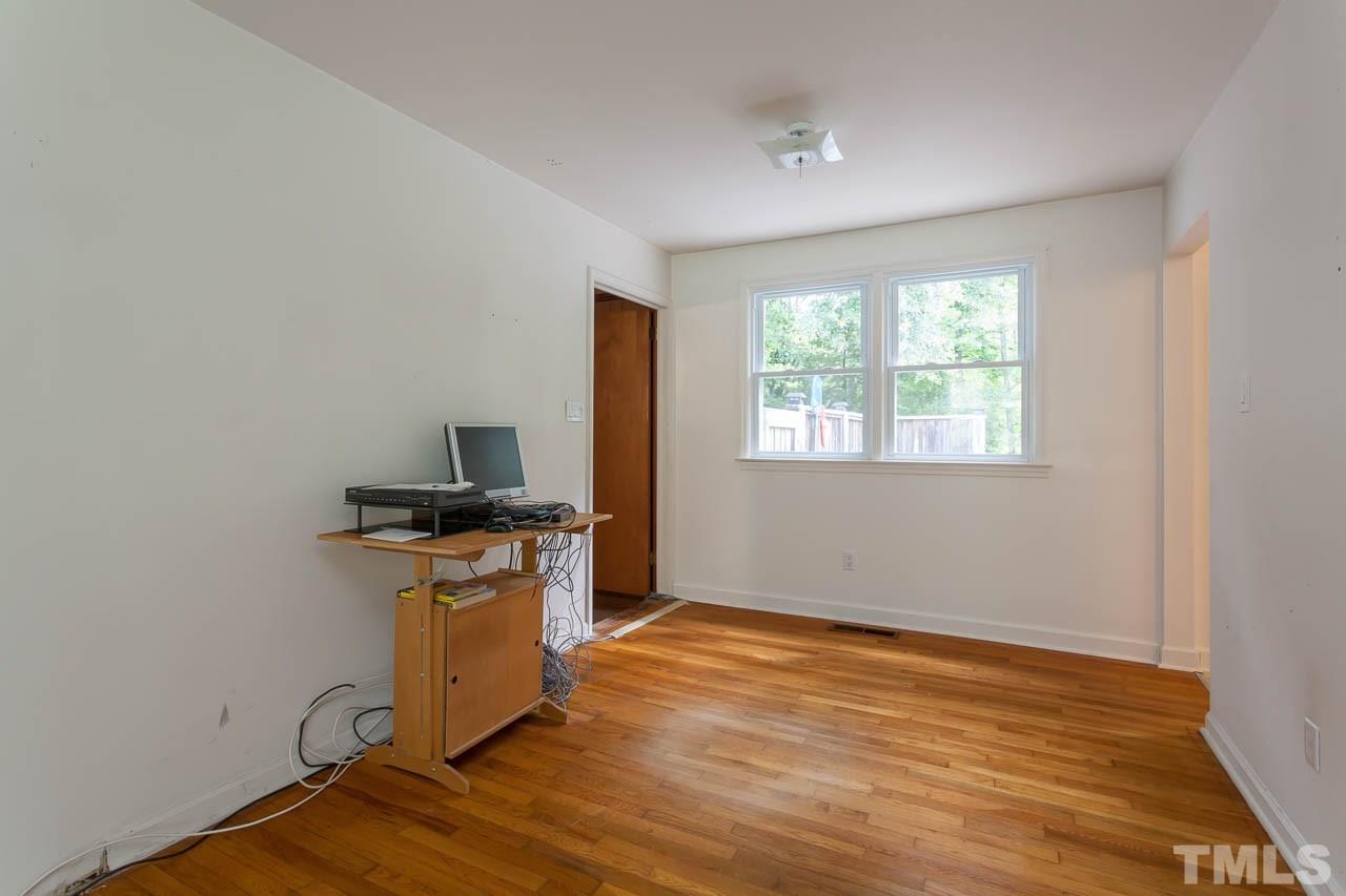 2252 Rumson Road Raleigh, NC 27610 - Photo 15 of 20 an empty room with a window