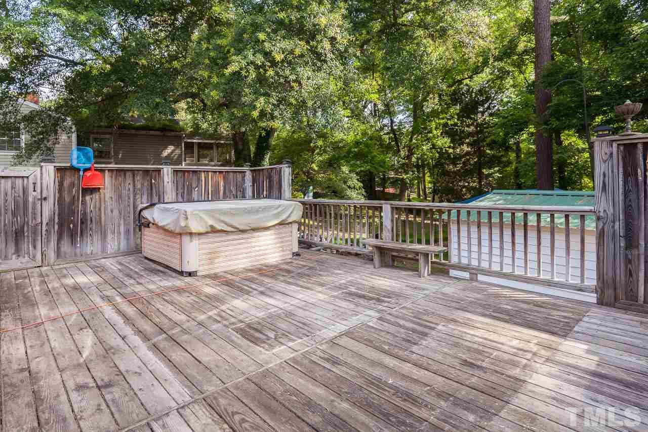 2252 Rumson Road Raleigh, NC 27610 - Photo 20 of 20 a view of deck with two chairs and wooden floor