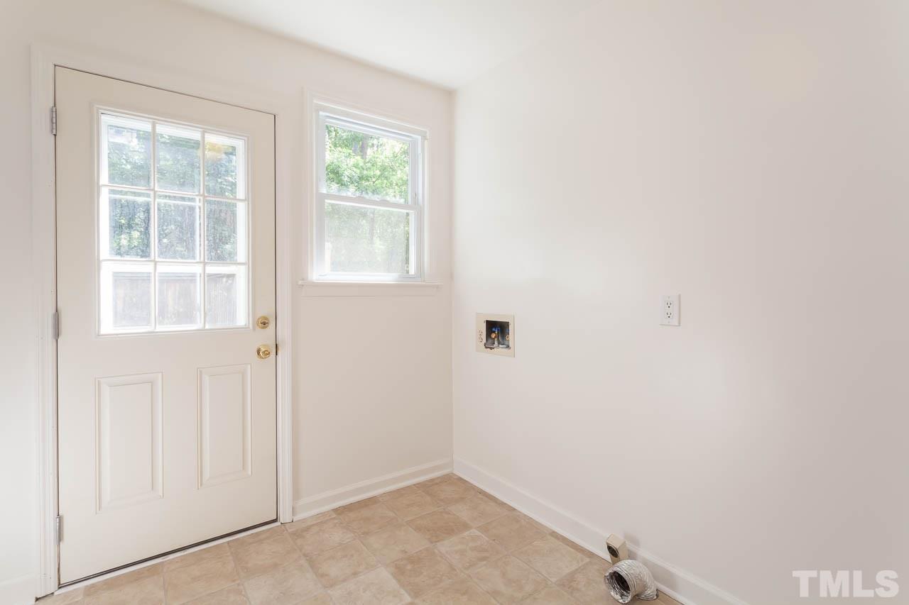 2252 Rumson Road Raleigh, NC 27610 - Photo 3 of 20 an empty room with a window