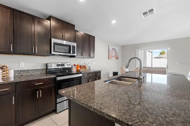 a bedroom with a bed and a dresser in it