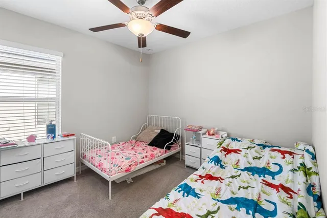 an aerial view of a house with a lake view