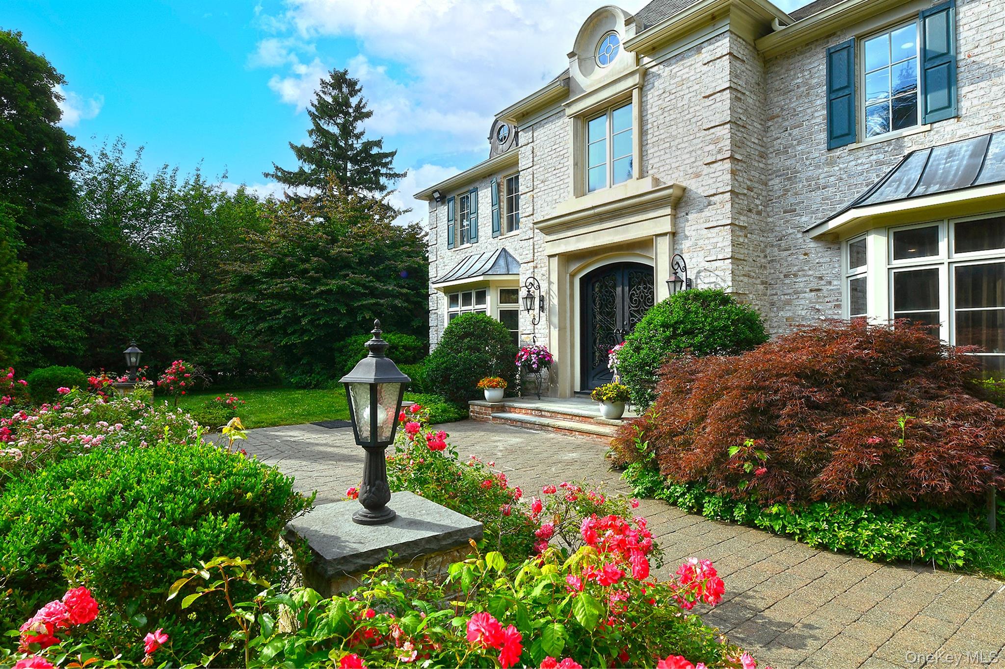 14 Norgate Road Glen Head, NY 11545 - Photo 3 of 44 a front view of a house with a yard and fountain in middle