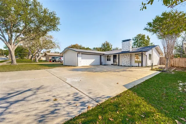 a house with garden in front of it