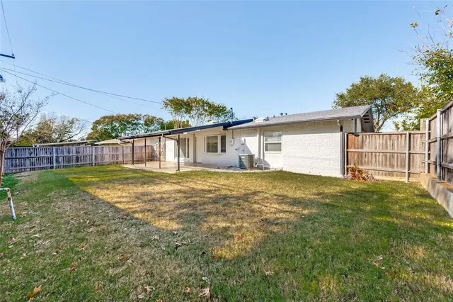 a view of backyard with outdoor space