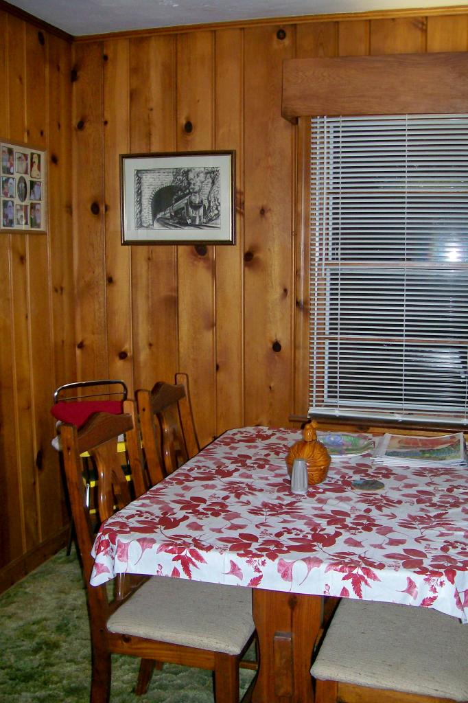1494 Mill Iron Road Goodview, VA 24095 - Photo 6 of 10 a bedroom with a bed and a table in it