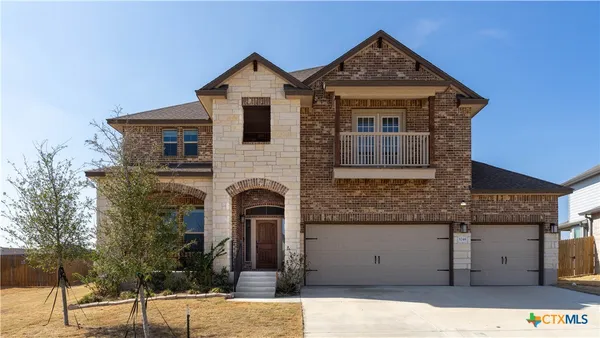 a front view of a house with garage