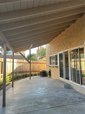 a view of balcony with wooden fence