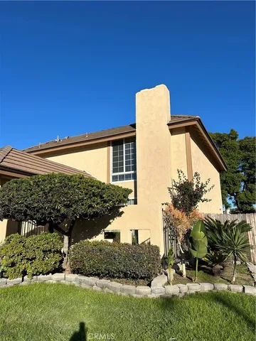 a view of a house with a garden