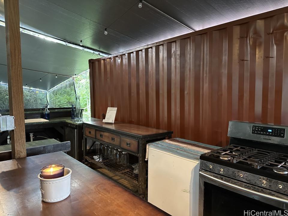 a kitchen with wooden cabinets and a stove