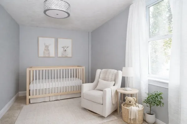 a bedroom with furniture and a window